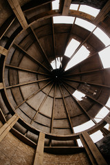 
old roof of a dilapidated building against the sky. Roof hole