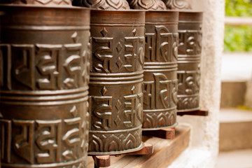 Ancient Tibetan prayer wheels for prayer purposes.