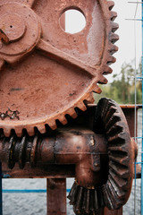 
Rusty gears of a rotary mechanism in fuel oil, shot close. Dirty old gears