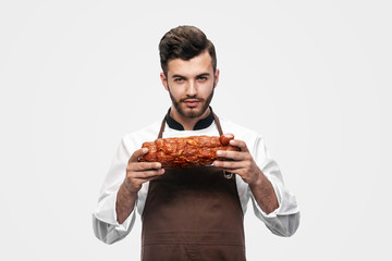 portrait of chef, holding a ham in his hands