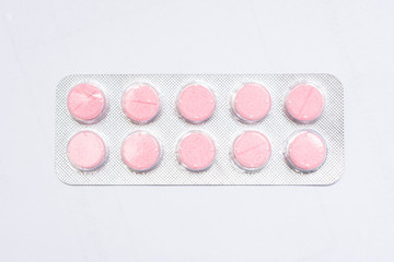 Pills packed in blister , white background, top view