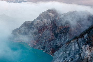 Toxic volcano Ijen on Java island, Indonesia. Foggy sunrise, another planet landscape.