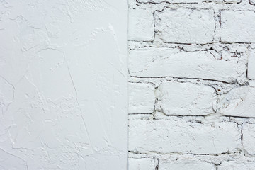 White plaster and white brick wall, half plaster and half brick, texture, abstract background