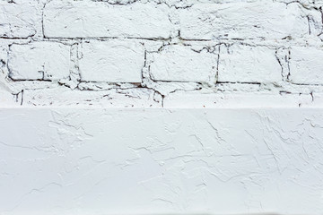 White plaster and white brick wall, half plaster and half brick, texture, abstract background