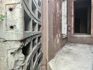 Old Soviet bunker. Rusty walls and concrete slabs.