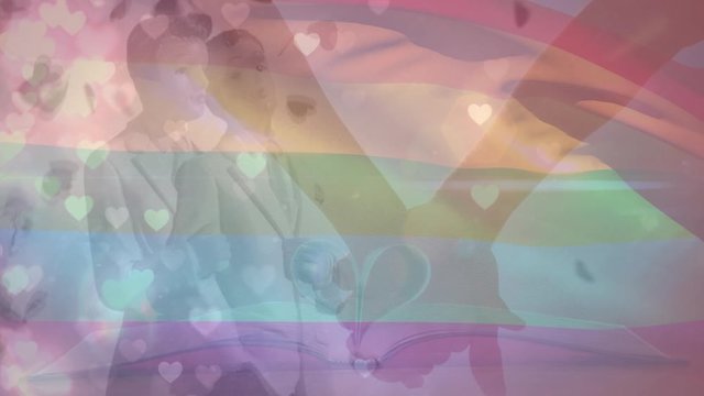 Animation of holding hands and wedding cake men on LGBTQ+ flag background
