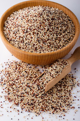 mix of quinoa grains on white acrylic background