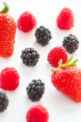 Close-up of berries on white background