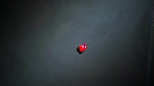 Red dice falling and bouncing