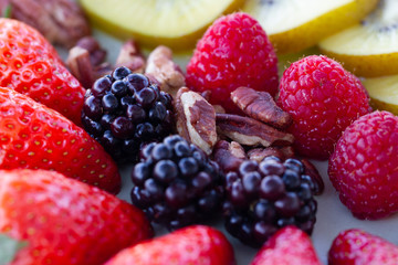 Breakfast plate with fruits and pecan nuts