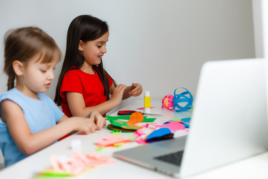 Learning From Home, Home School Kid Concept. Little Children Study Online Learning From Home With Laptop. Quarantine And Social Distancing Concept.