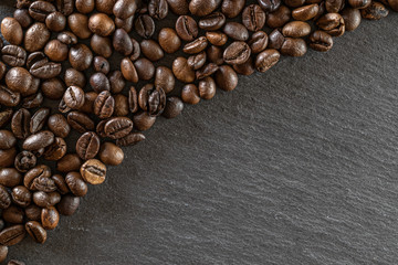 Black coffee background. Caffeine espresso beans for breakfast dark drink in cup. Cafe food. Assorted ground and instant brown roasted coffee seeds on stone. Copy space, top view