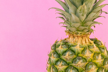 Closeup of Whole Pineapple on Pink Background