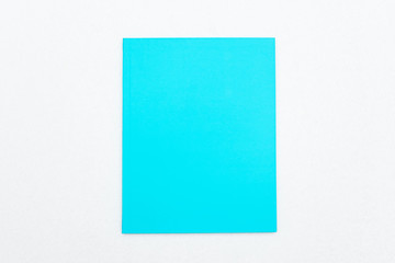 Blue notebook on white background, top view, copy space