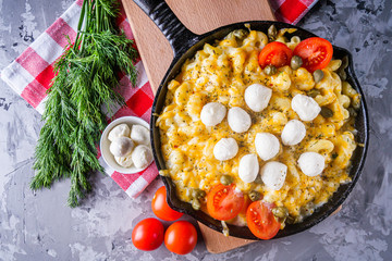 delicious pasta and cheese casserole in a cast iron skillet