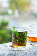 Glass of hot mint tea, traditional moroccan moorish beverage