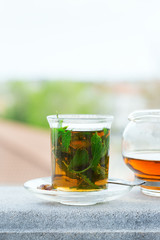 Glass of hot mint tea, traditional moroccan moorish beverage