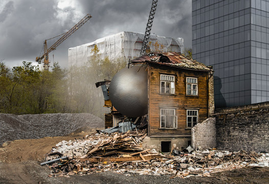 A gray and dusty cityscape of real estate development - an old historic wooden house is being demolished with a wrecking ball while a new skyscraper is ready and another one being constructed