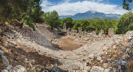 Fototapeta na wymiar Ruins of amphitheatre of ancient Phaselis city. Panorama view on famous architectural landmark, Kemer district, Antalya province.