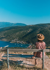 Woman watches the view from the top of the mountain. Kefalonia island, Greece