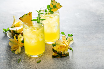 Tropical pineapple cocktail, refreshing summer drink in tall glass