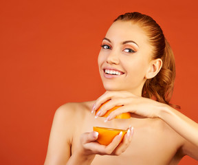 beautiful woman with orange on an orange background