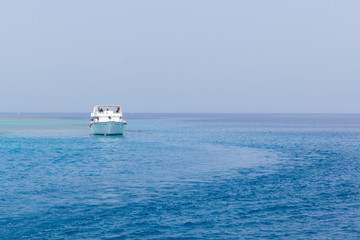 Boat yachting in the blue sea, landscape of ship in calm open ocean