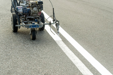road painting with airbrush and repair and marking on asphalt pavement