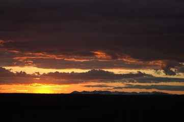 Orange sunset at the beginning of the Polar summer