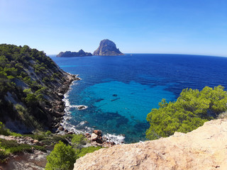 Fototapeta premium naturalistic maritime panorama of Es Vedra in the sea of ​​Ibiza from Cala d'Hort