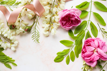 Fototapeta na wymiar postcard mockup. floral background. Floral frame of pink roses and white acacia. congratulation. invitation