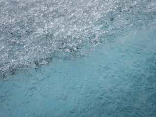 Ice structures on the black lava beach, placed near Jokulsarlon glacier lagoon.