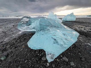 The famous Diamond beach in South Iceland. Giant ice gems on the black lava beach, placed near Jokulsarlon glacier lagoon.