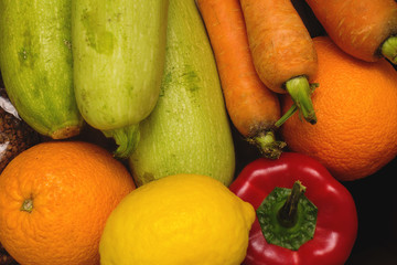 Donation. Products in a cardboard box. The volunteer brought the products for people to self-isolation. Products on a background close-up, a place for an inscription. Products for the poor