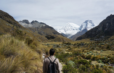Man trekking in the mountains of Huascaran Park, Peru