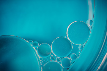 Oil drops on the water - Abstract background blue macro photography