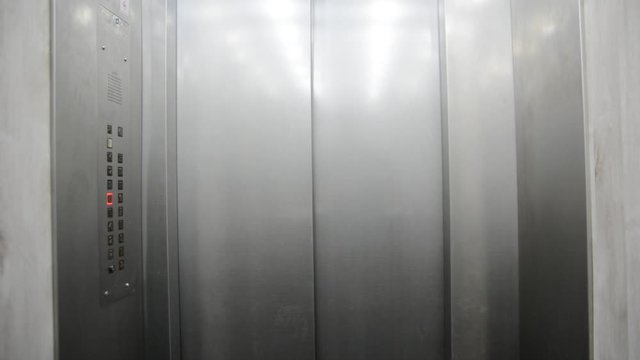 Modern elevator in the modern building opens the door