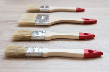 New paint brushes of different sizes. The concept of choice and diversity.