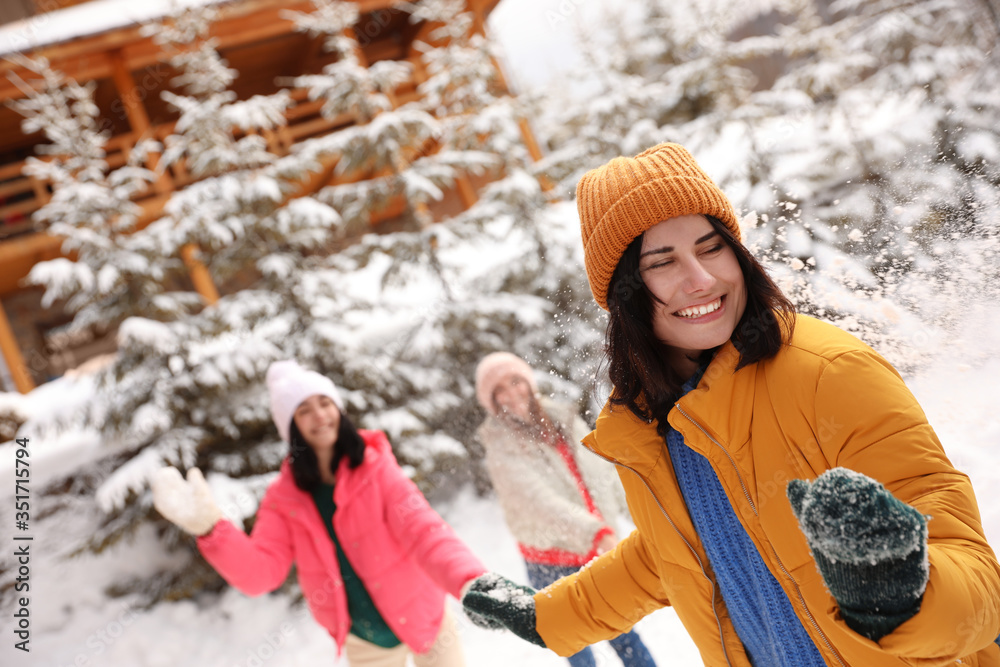 Canvas Prints Group of friends playing snowballs outdoors. Winter vacation