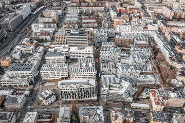 Aerial drone shot view of building complex with solar panels on