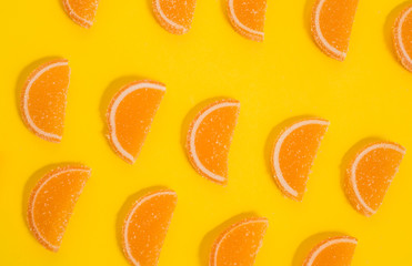 On a yellow background is a row of marmalade-slices