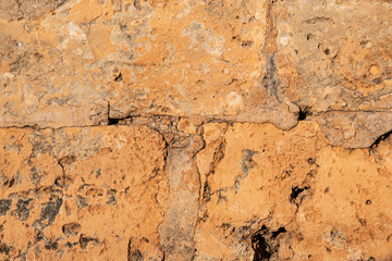 Muro antiguo de piedra porosa