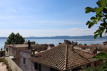 Fototapeta na wymiar roofs of the old town on lake near rome italy