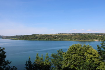 aerial view of a beautiful lake with tree and moutains near lake bracciano rome italy 