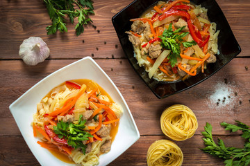 lagman homemade noodle soup on a wooden table