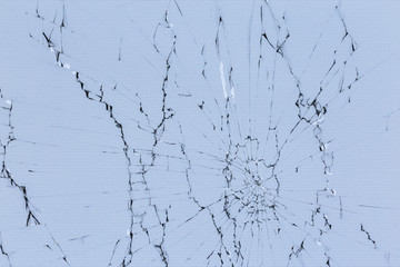 flat texture of cracked glass tft lcd screen with localized radial cracks