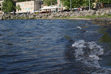 Waves of water in a blue lake water