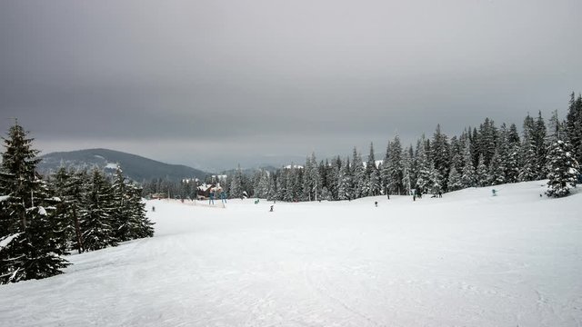 Skiers in winter wood. sky lift, 4K timelapse in Carpatian mountains, photographed on Nikon D800 camera.