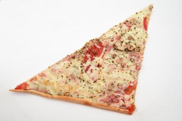 
A triangular piece of square pizza with sausage and tomatoes on a white background