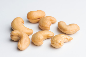 Composition of whole cashews on a white background